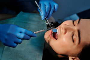 dental hygienist fixing insufficient oral hygiene during dental appointment