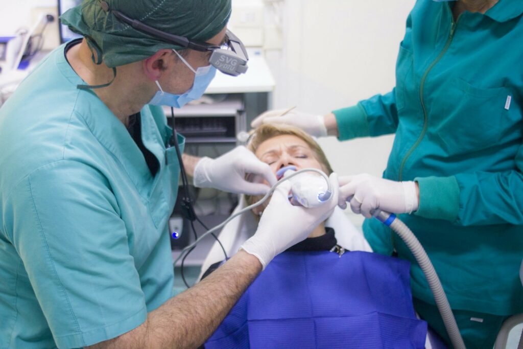 Dentist Treating Patient with Gum Disease