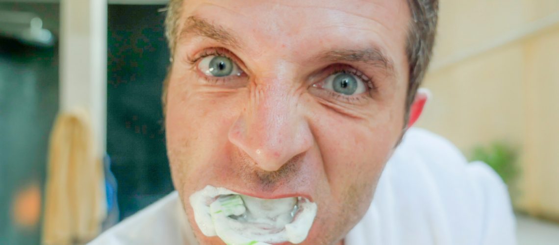 Man Bruhing His Teeth - gilbert dentist