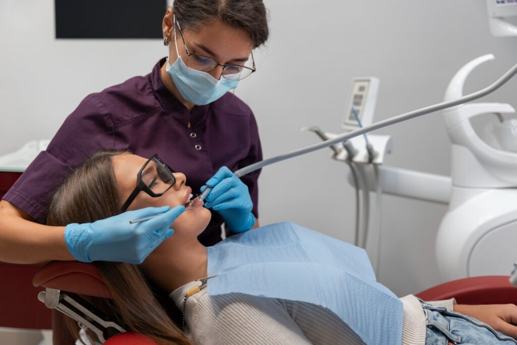 Emergency Dentist Performing Emergency Dental Procedure