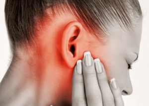 Woman Experiencing Severe TMJ Pain